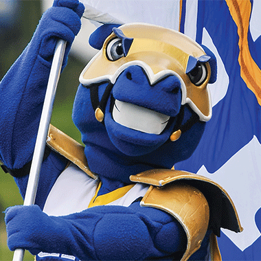 Charlie the Charger with a flag