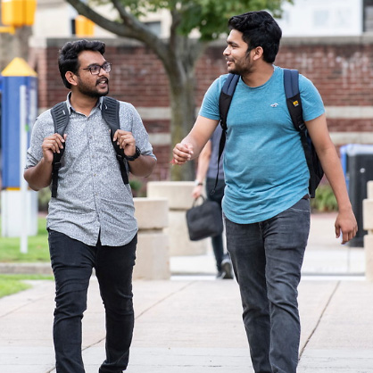 Image of two students walking