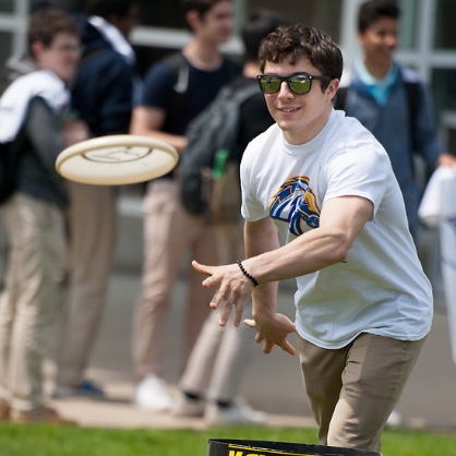 Image of student throwing frisbee