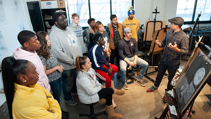 Image of Joe Smolinski (right) and students.