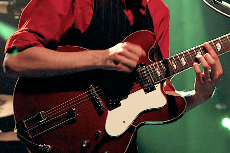 An image of a student playing the guitar for the music idustry program.