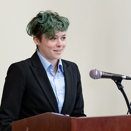 Gianna Cologna ’25, ’26 M.S. speaks as part of the recognition ceremony.