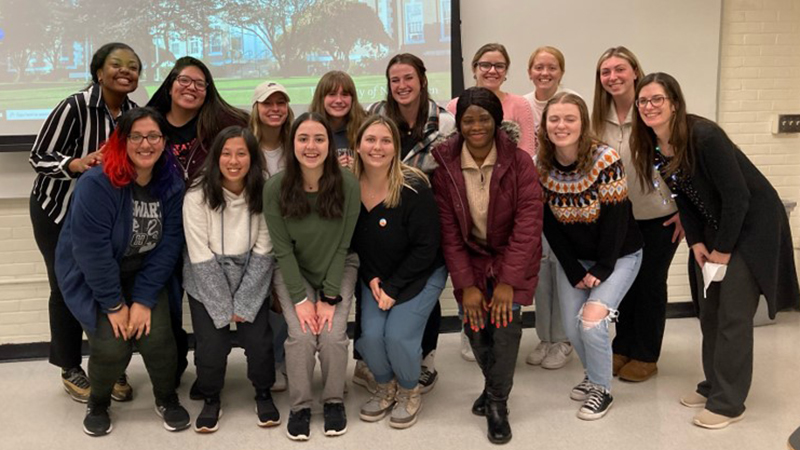 Hunter Clark ’24 M.A. with her fellow community psychology students.