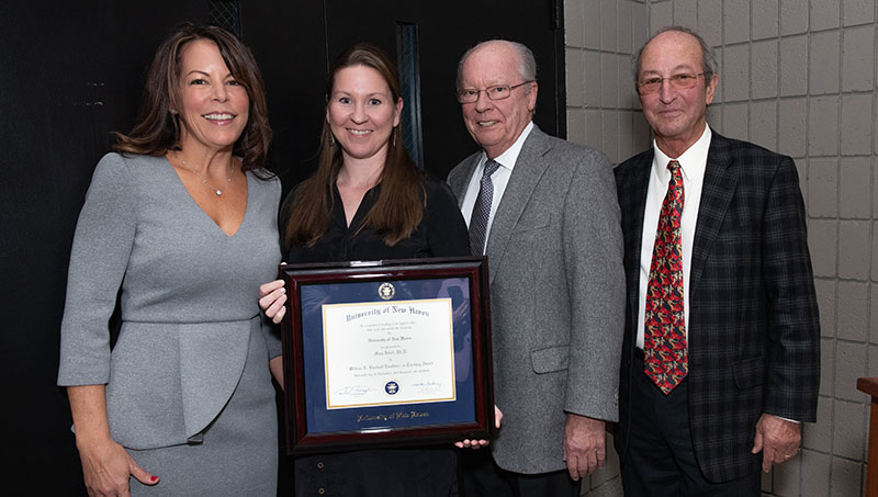 Photo of Mary Isbell, Ph.D., William L. Bucknall Jr. ’63, ’65, ’08 Hon., President Steven H. Kaplan. 