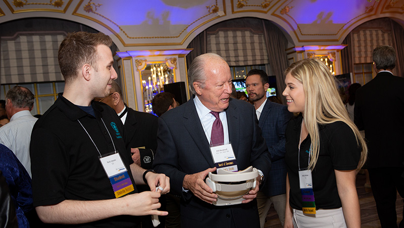 Image of Nick Amato '20, Holly Barkal '21, and Bill Bucknall '63, '65, '08.