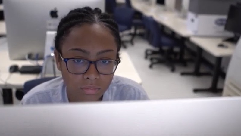 Amber Marrero working on a computer.