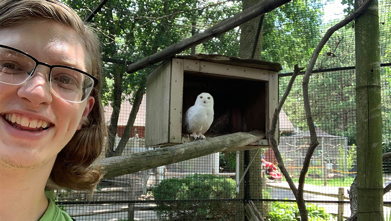 Christopher Lapointe ’22 with a barred owl.