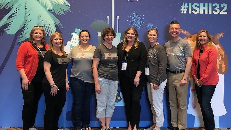 Claire Glynn, Ph.D., and her students at a conference.