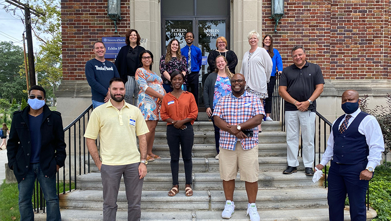 The University of New Haven’s inaugural Doctor of Health Sciences cohort on the steps of Echlin Hall.