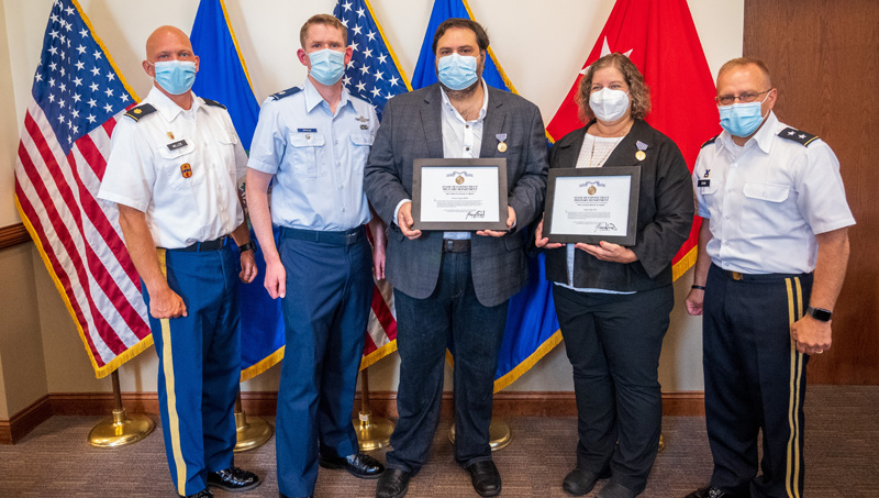 Liberty Page '91 M.S. and Ibrahim Baggili, Ph.D., were awarded a Civilian Medal of Merit.