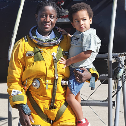 Image of Merryl Tengesdal ’94 holding her son