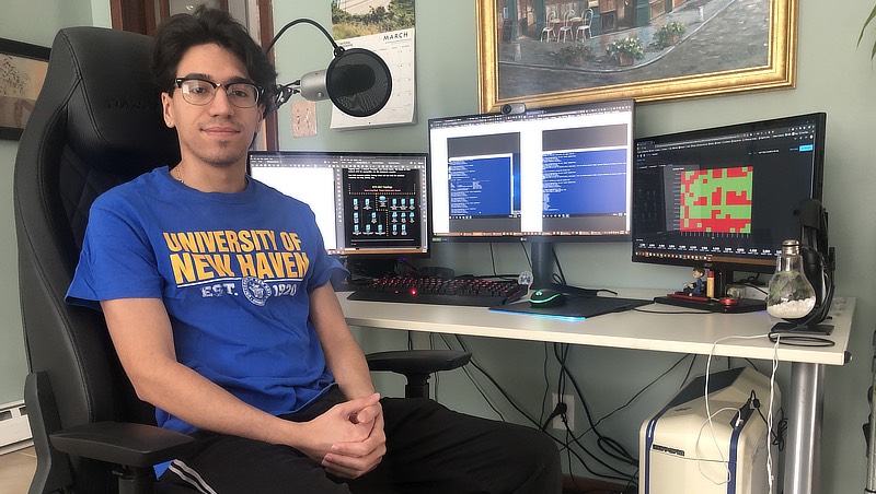 Steven Atilho ’22 at his home work station.