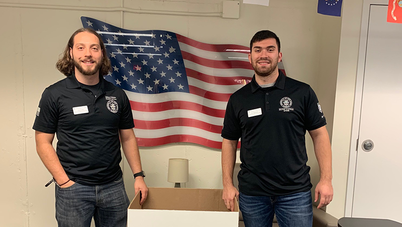 Vincent Franco ’25 (left) and Joshua Wyskiewicz ’25 are charged up to support Toys for Tots.