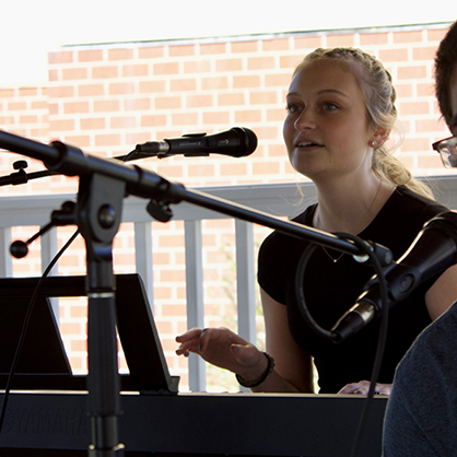 Emily Verge ’24 performs at a showcase on campus with the University’s Music Industry Club.