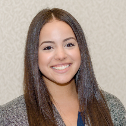 An image of smiling business management alumnus, Alinett Collado.